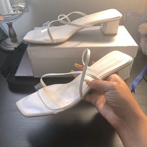 White strappy mule sandals with clear strap